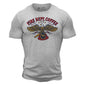 The front side of a light grey t shirt. On the chest of the t shirt is an eagle holding an FDC fire helmet. Above the eagle is text that reads ”Fire Dept. Coffee”