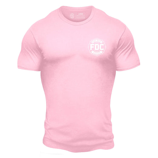 Front side of light pink t shirt with white FDC maltese cross logo on the chest.