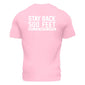 Back side of light pink t shirt with large white lettering that reads ”Stay back 500 feet until I’ve had my coffee” across the top