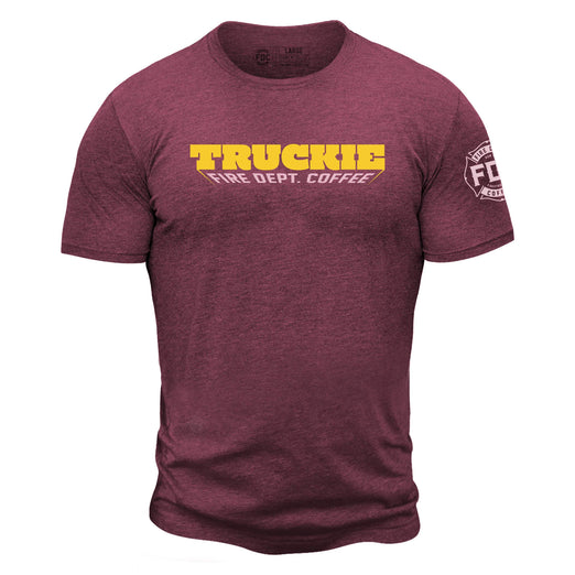 Maroon shirt with ”truckie” in bold yellow lettering and ”Fire Dept. Coffee” below. FDC maltese cross logo is on the sleeve.